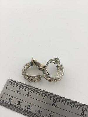 Unmarked silver tone clip on vintage earrings
