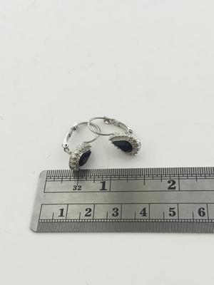 Silver tone unmarked black center earrings
