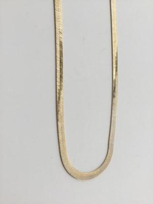 Gold tone chain like necklace