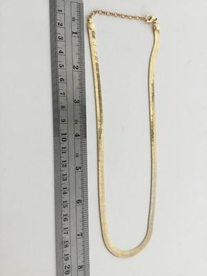 Gold tone chain like necklace