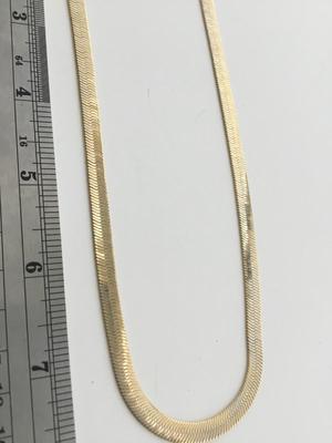 Gold tone chain like necklace