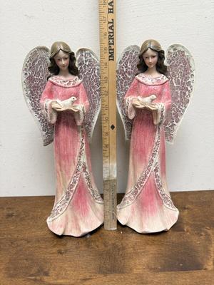 Sale Photo Thumbnail #60: In pink & white gowns, holding a dove. Good condition. Approx. 16" tall. Battery powered lights in the angel wings.Tested, works as expected.