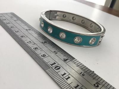 Silver tone light blue bangle bracelet