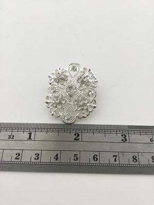 Silver tone rhinestone brooch