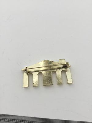 Gold tone MM roof brooch vintage