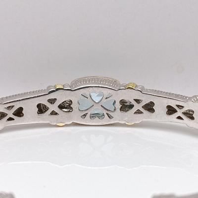 LOT 310: Judith Ripka 925 Sterling Silver and 18K Gold Cuff Bracelet with Blue Topaz Center