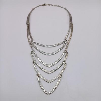 LOT 308: Justin & Taylor Silver-Tone Hammered Metal Statement Necklace and Earrings