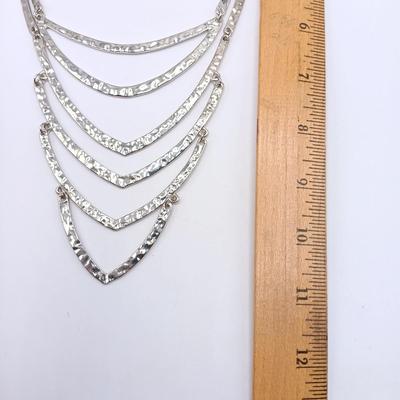 LOT 308: Justin & Taylor Silver-Tone Hammered Metal Statement Necklace and Earrings