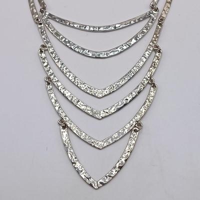 LOT 308: Justin & Taylor Silver-Tone Hammered Metal Statement Necklace and Earrings