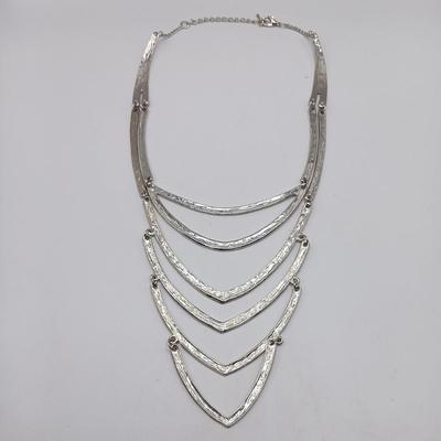 LOT 308: Justin & Taylor Silver-Tone Hammered Metal Statement Necklace and Earrings