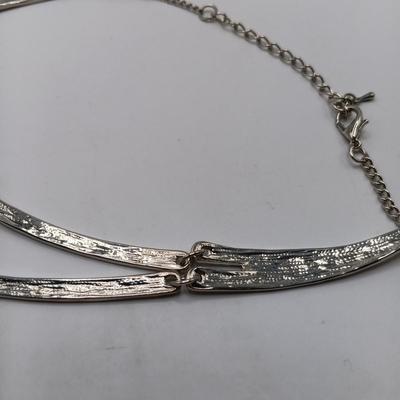 LOT 308: Justin & Taylor Silver-Tone Hammered Metal Statement Necklace and Earrings