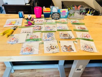 A BUNCH OF NICELY SORTED STICKERS, HOLE PUNCH, MUSIC BULLET SPEAKER, MAGNETS, SMALL ORGANIZERS AND MORE!