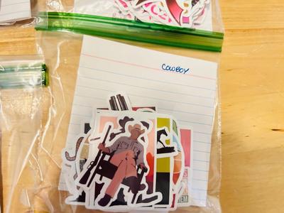 A BUNCH OF NICELY SORTED STICKERS, HOLE PUNCH, MUSIC BULLET SPEAKER, MAGNETS, SMALL ORGANIZERS AND MORE!