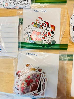 A BUNCH OF NICELY SORTED STICKERS, HOLE PUNCH, MUSIC BULLET SPEAKER, MAGNETS, SMALL ORGANIZERS AND MORE!