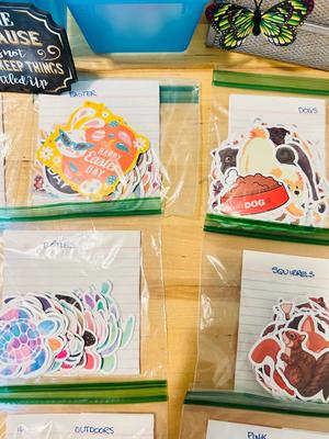 A BUNCH OF NICELY SORTED STICKERS, HOLE PUNCH, MUSIC BULLET SPEAKER, MAGNETS, SMALL ORGANIZERS AND MORE!