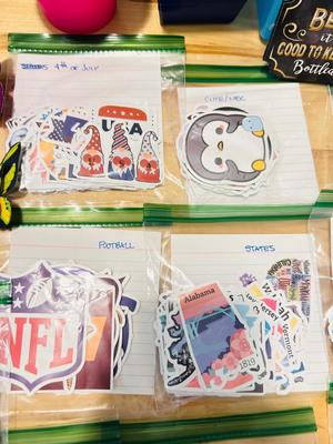 A BUNCH OF NICELY SORTED STICKERS, HOLE PUNCH, MUSIC BULLET SPEAKER, MAGNETS, SMALL ORGANIZERS AND MORE!