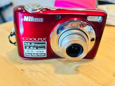 NIKON COOL PIX L22 DIGITAL CAMERA, STICKERS, AND PHOTO PAPER