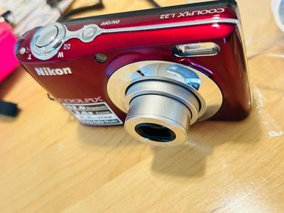 NIKON COOL PIX L22 DIGITAL CAMERA, STICKERS, AND PHOTO PAPER