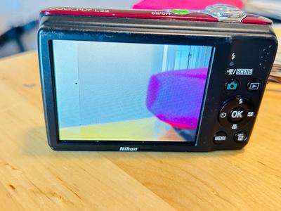 NIKON COOL PIX L22 DIGITAL CAMERA, STICKERS, AND PHOTO PAPER