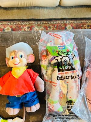 LION KING CANDY DISPERSER, FIVEL GOES WEST GUY, AND TOY STORY CHARACTERS
