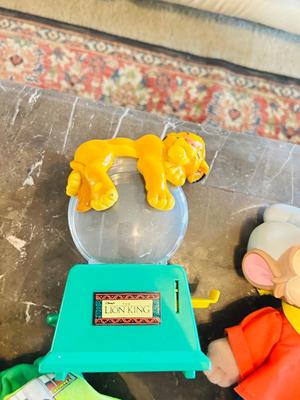 LION KING CANDY DISPERSER, FIVEL GOES WEST GUY, AND TOY STORY CHARACTERS