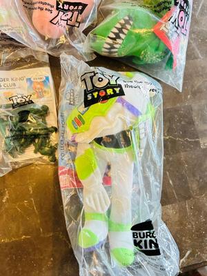 LION KING CANDY DISPERSER, FIVEL GOES WEST GUY, AND TOY STORY CHARACTERS