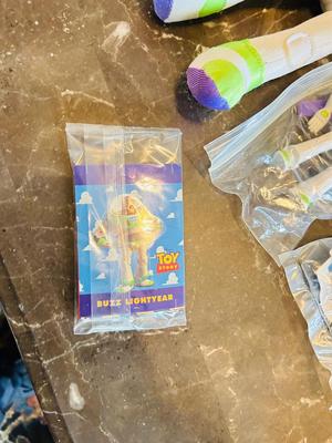 LION KING CANDY DISPERSER, FIVEL GOES WEST GUY, AND TOY STORY CHARACTERS