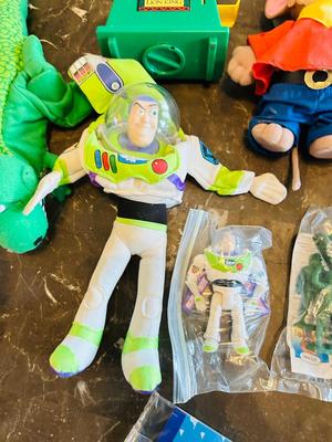 LION KING CANDY DISPERSER, FIVEL GOES WEST GUY, AND TOY STORY CHARACTERS