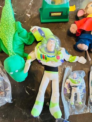 LION KING CANDY DISPERSER, FIVEL GOES WEST GUY, AND TOY STORY CHARACTERS