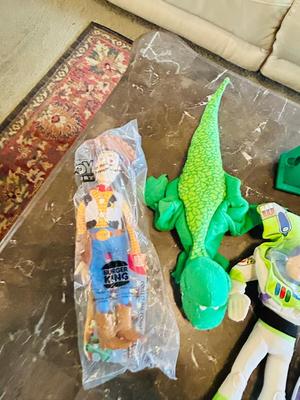 LION KING CANDY DISPERSER, FIVEL GOES WEST GUY, AND TOY STORY CHARACTERS