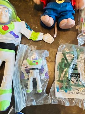 LION KING CANDY DISPERSER, FIVEL GOES WEST GUY, AND TOY STORY CHARACTERS