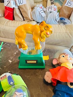 LION KING CANDY DISPERSER, FIVEL GOES WEST GUY, AND TOY STORY CHARACTERS