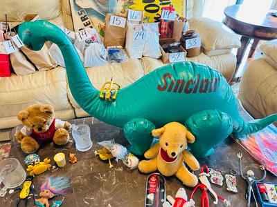 A VARIETY OF DIFFERENT TOYS AND OTHER ITEMS EVEN AN INFLATABLE SINCLAIR DINOSAUR
