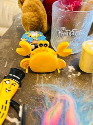 A VARIETY OF DIFFERENT TOYS AND OTHER ITEMS EVEN AN INFLATABLE SINCLAIR DINOSAUR