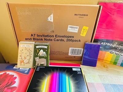 200 ct PACK OF BLANK INVITATIONS AND ENVELOPES, 2 LARGE ROLLS OF VINYL, AND AN ARRAY OF NOTEPADS AND COLORED PAPER