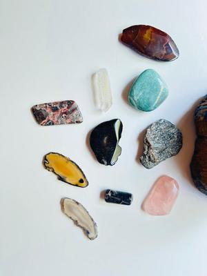 LARGE PIECE OF PETRIFIED WOOD, CRYSTAL, AND OTHER POLISHED STONES