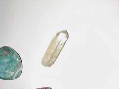 LARGE PIECE OF PETRIFIED WOOD, CRYSTAL, AND OTHER POLISHED STONES