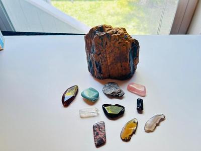 LARGE PIECE OF PETRIFIED WOOD, CRYSTAL, AND OTHER POLISHED STONES