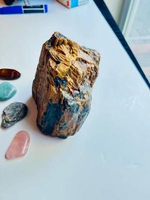 LARGE PIECE OF PETRIFIED WOOD, CRYSTAL, AND OTHER POLISHED STONES