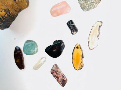 LARGE PIECE OF PETRIFIED WOOD, CRYSTAL, AND OTHER POLISHED STONES
