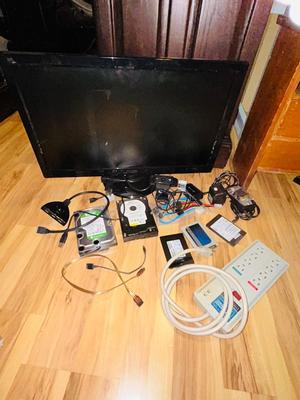HP MONITOR, POWER STRIP, HARD DRIVES, LOGITECH CAMERA