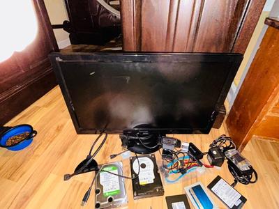 HP MONITOR, POWER STRIP, HARD DRIVES, LOGITECH CAMERA