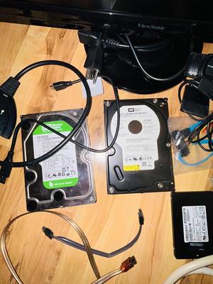 HP MONITOR, POWER STRIP, HARD DRIVES, LOGITECH CAMERA