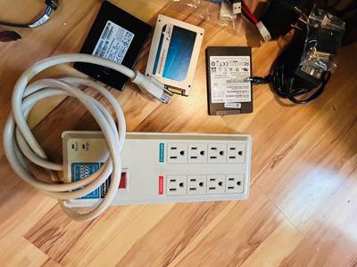 HP MONITOR, POWER STRIP, HARD DRIVES, LOGITECH CAMERA