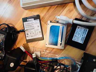 HP MONITOR, POWER STRIP, HARD DRIVES, LOGITECH CAMERA