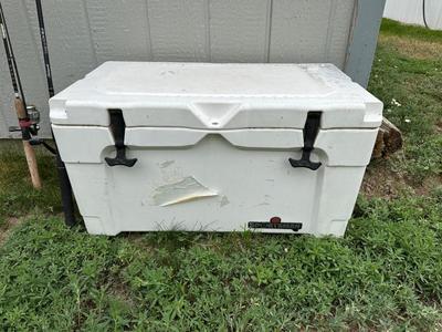 2 FISHING POLES WITH REELS AND A COOLER