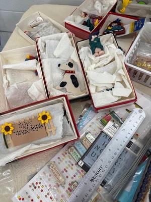 Tote of completed, handmade polymer figurines