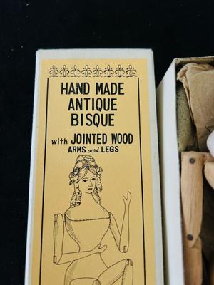 CLASSIC BRIDE OF THE CENTURY, “FLORA” with certificate of authenticity AND REPRODUCTION ANTIQUE HANDMADE WOOD & BISQUE DOLL