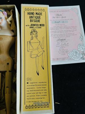 CLASSIC BRIDE OF THE CENTURY, “FLORA” with certificate of authenticity AND REPRODUCTION ANTIQUE HANDMADE WOOD & BISQUE DOLL