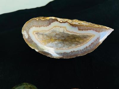 POLISHED EGG SHAPED ROCKS, OTHER STONES, AND MINERALS.